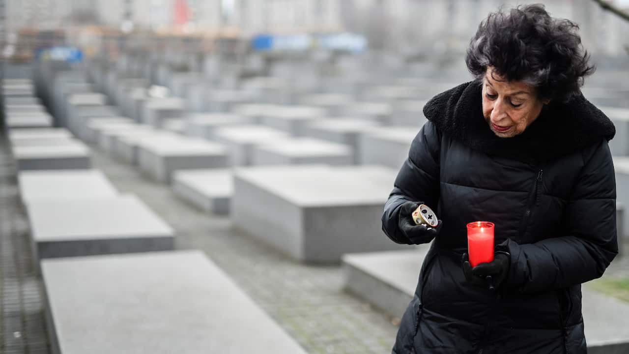 Chairwoman of the Foundation for a Memorial to the Murdered Jews of Europe Lea Rosh lights a memorial candle at the 'Holocaust memorial' in Berlin.