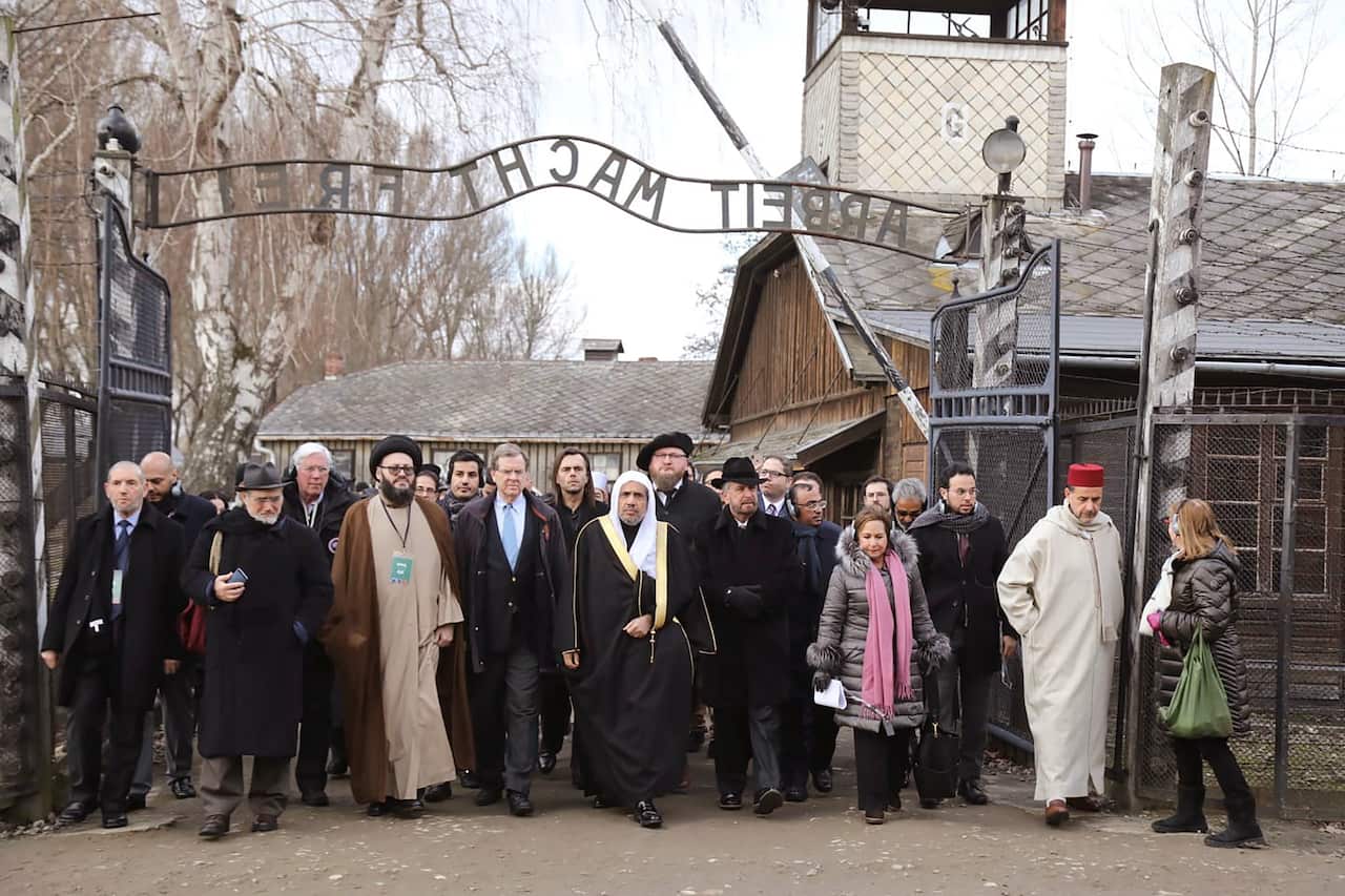 Inter-faith leaders beneath the infamous “Work Sets You Free” gates at Auschwitz as part of the 75th anniversary of the camp’s liberation.