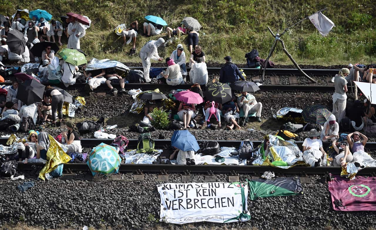 Activists block the tracks of the Hambach Railway, which connects the Hambach open-cast mine to the north-south railway.