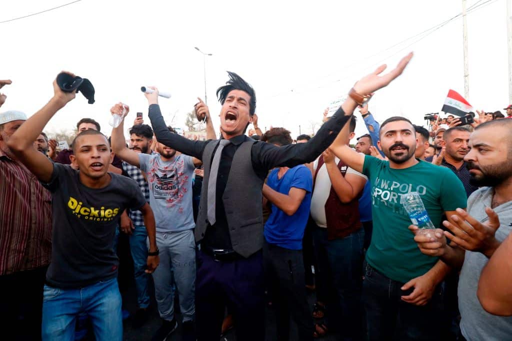 Iraqi protestors attend a gathering in the southern city Basra on July 27, 2018, to protest against unemployment and a lack of basic services. (Photo by Haidar MOHAMMED ALI / AFP)        (Photo credit should read HAIDAR MOHAMMED ALI/AFP/Getty Images)