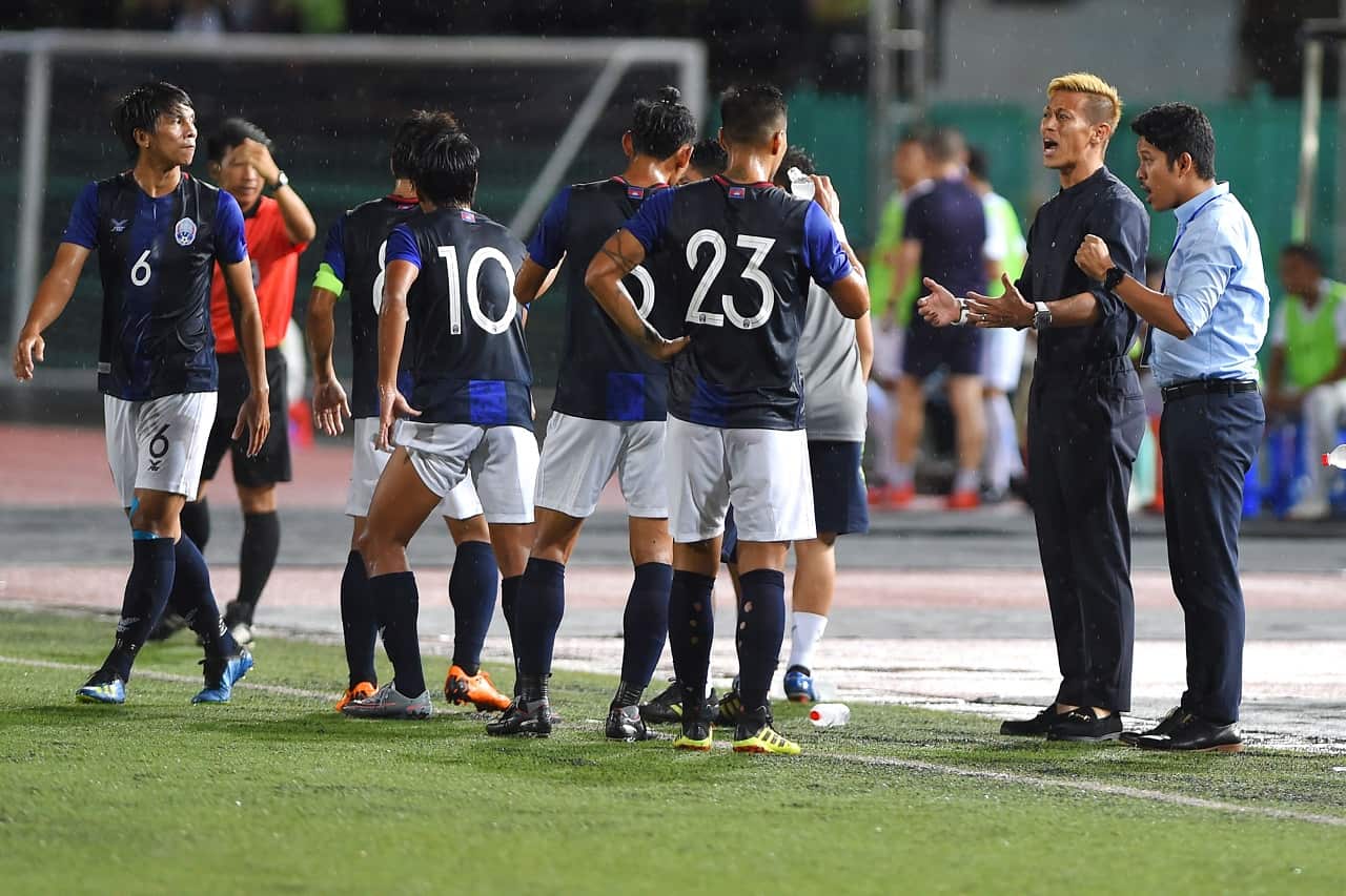 Keisuke Honda on the sidelines at a Cambodia game.