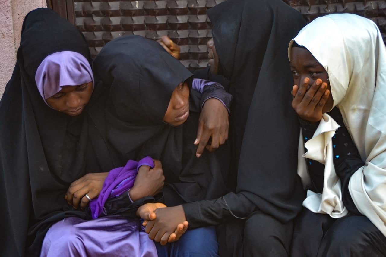 Mourners attend the burial of the alleged victims of the violent clashes in Abuja.