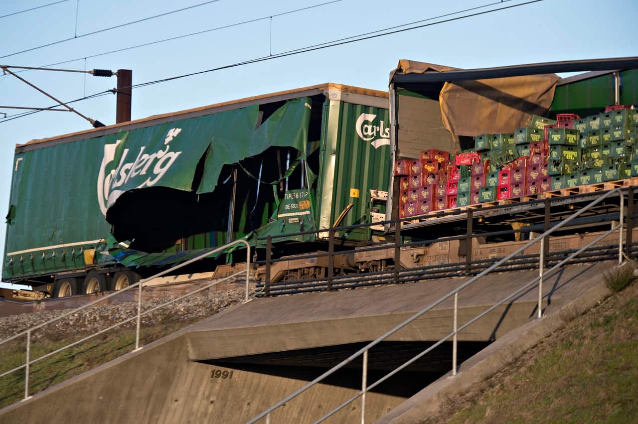 Damaged containers on a cargo train are seen on the Great Belt Bridge.