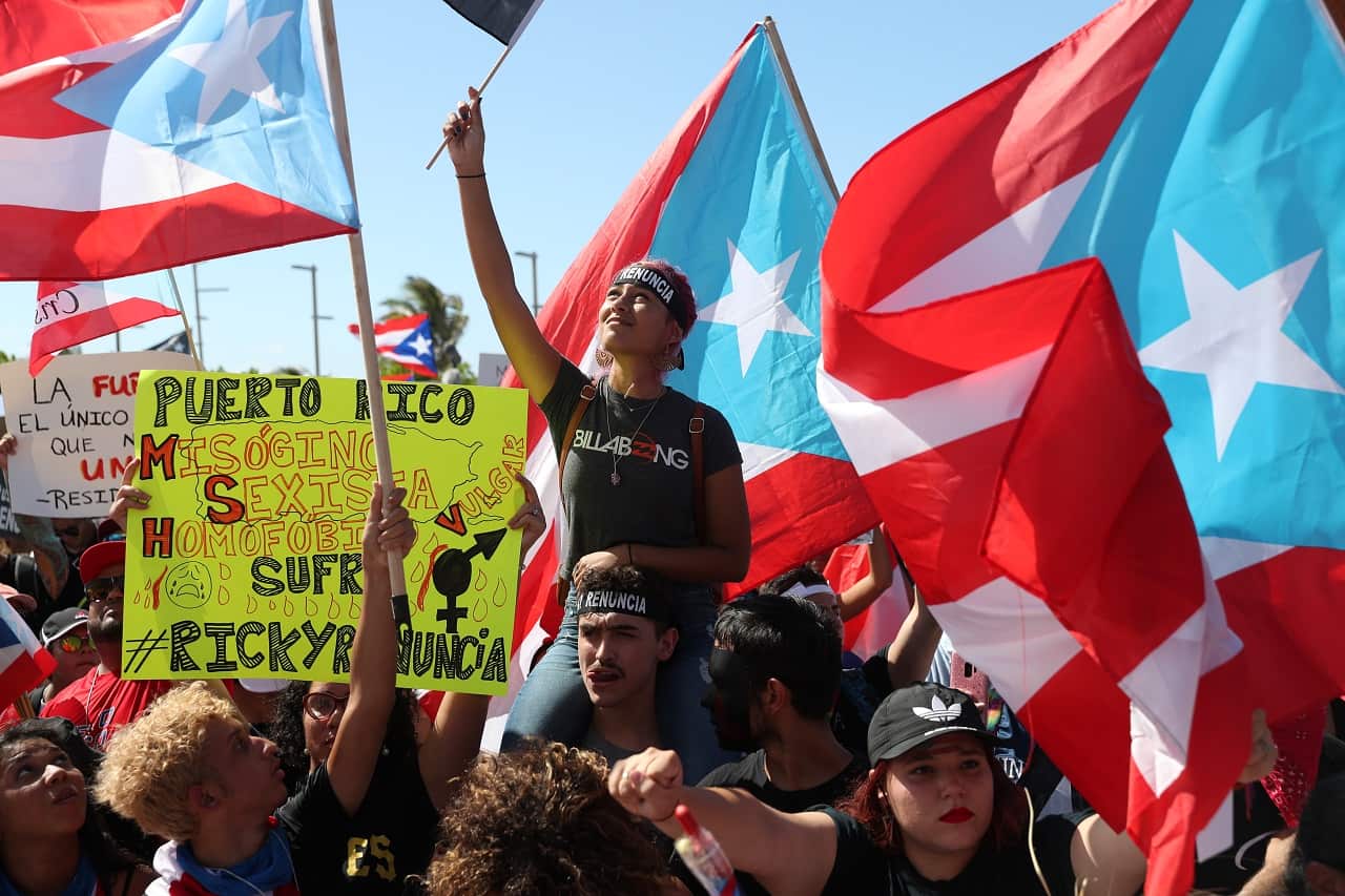 Demonstrators protest against Ricardo Rossello.