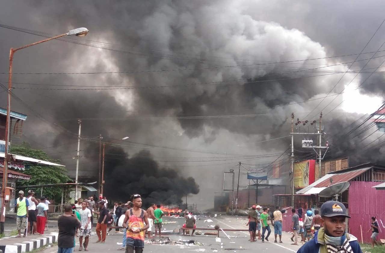 Riots broke out in Indonesia's Papua with a local parliament building torched as thousands protested allegations that police tear-gassed and arrested students.