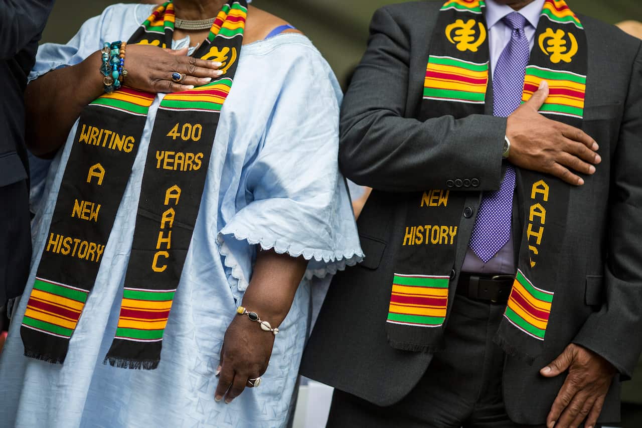Members of the audience wear sashes during the 2019 African Landing Commemorative Ceremony.