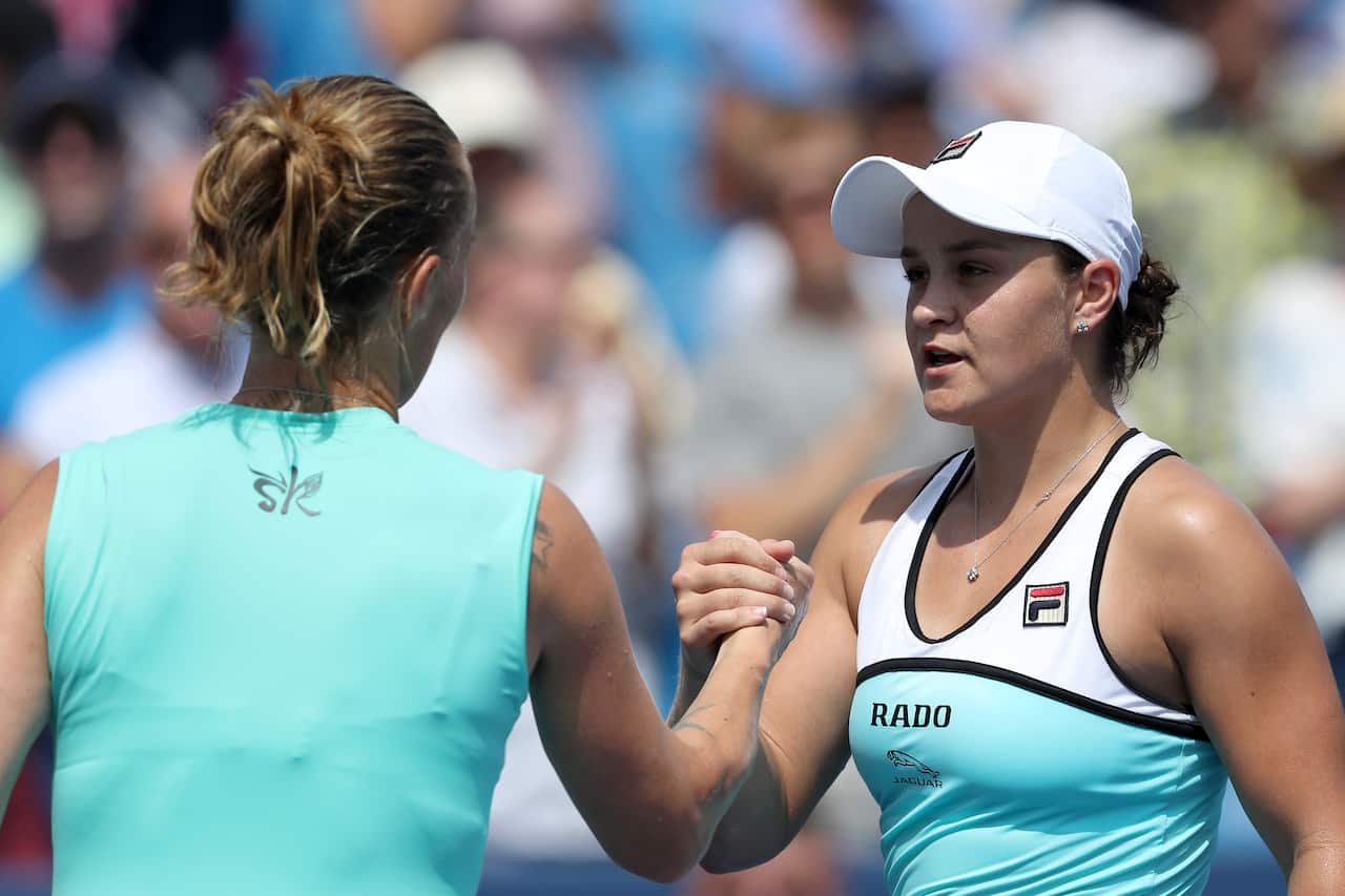 Ashleigh Barty of Australia (R) shakes hands with Svetlana Kuznetsova of Russia after losing in straight sets during Day 8 of the Western and Southern Open.