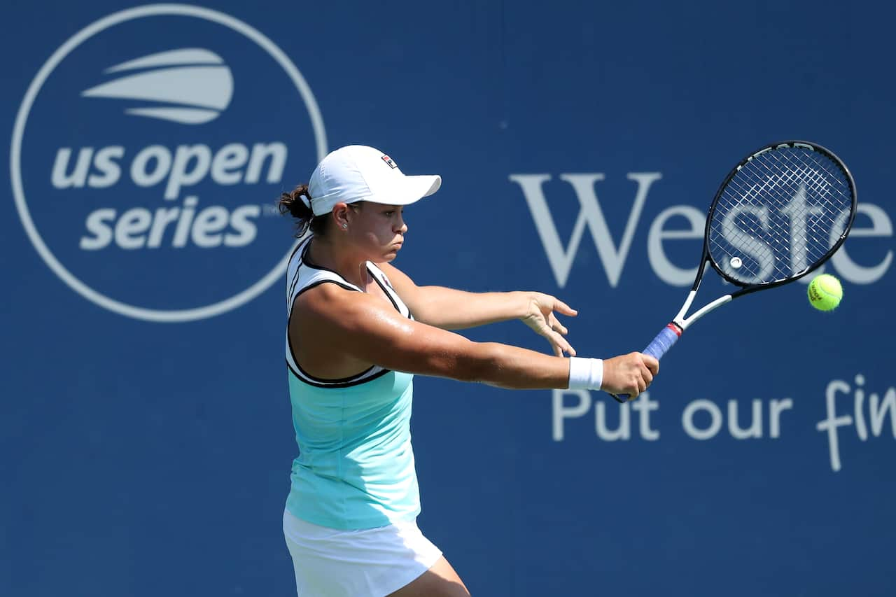 Ashleigh Barty of Australia returns a shot to Svetlana Kuznetsova of Russia during Day 8 of the Western and Southern Open.