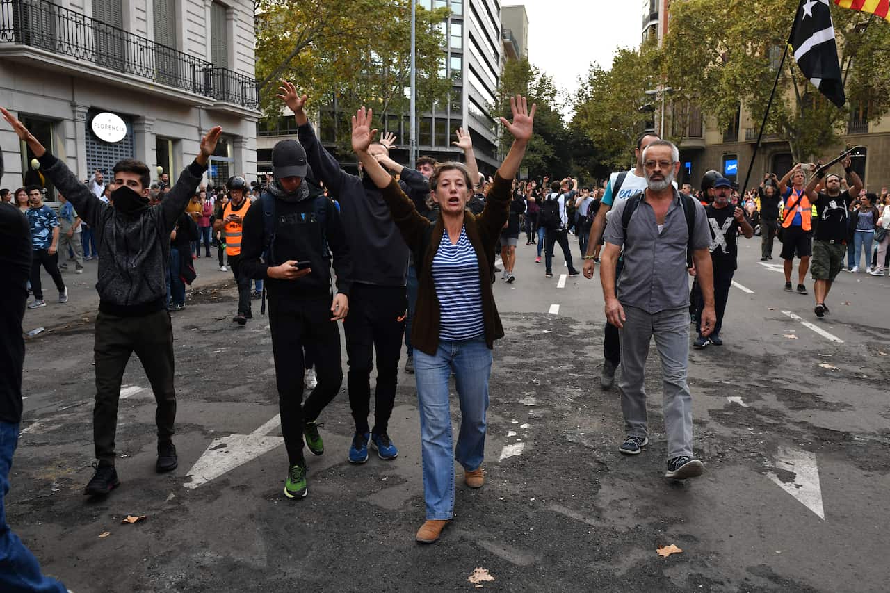 Police clash with protestors following a week of protests over the jail sentences given to separatist politicians by Spain's Supreme Court.