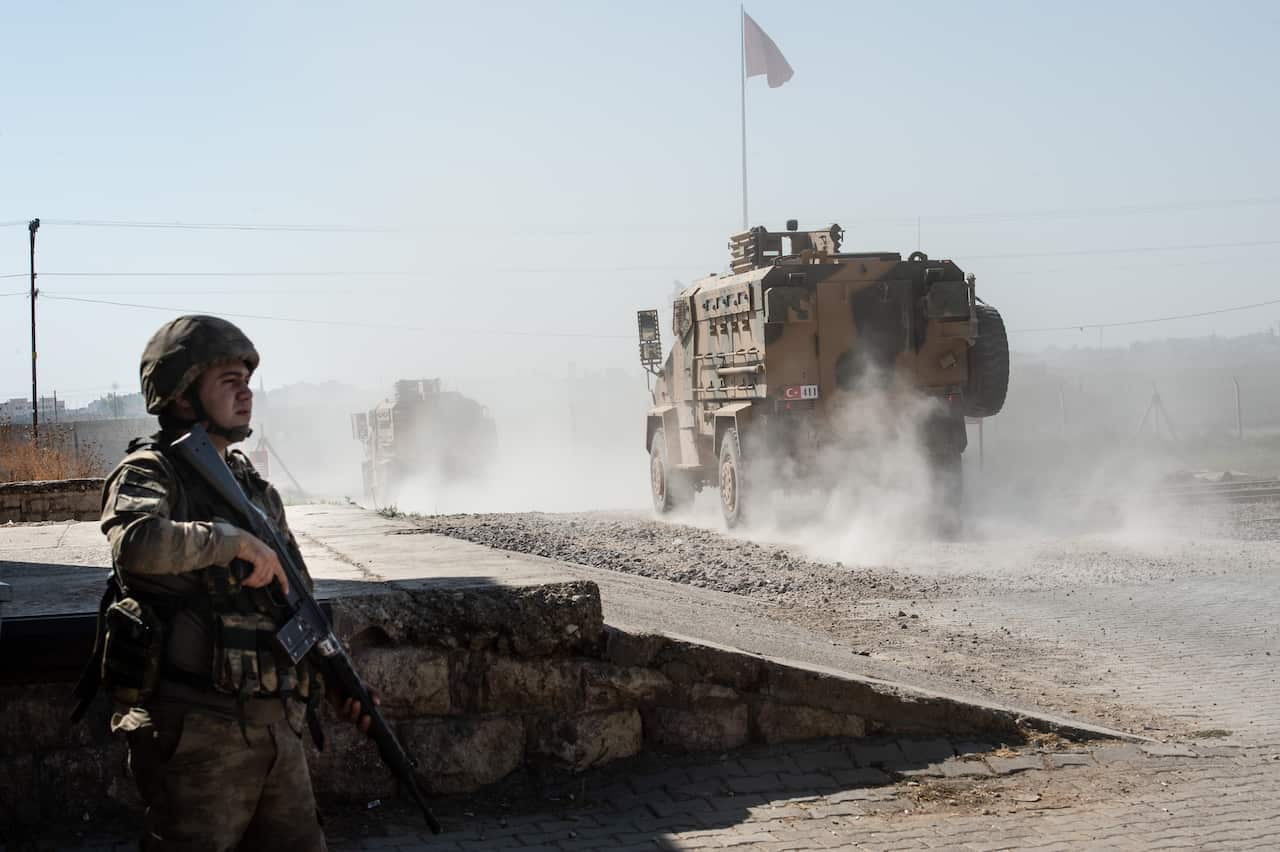 Turkish armoured vehicles enter Syria on 10 October in Akcakale.