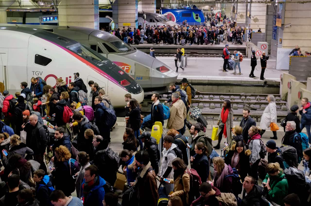 RATP users wait hours in crowded transport to get back home during a strike of the Paris public transports operator.