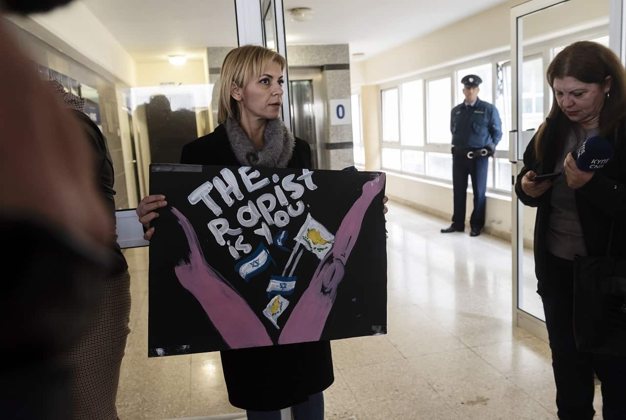 A women's rights activist protests in support of the British teenager.