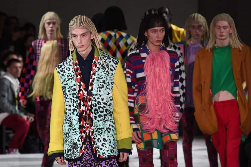 Models present creations by Comme Des Garons at Paris Fashion Show.