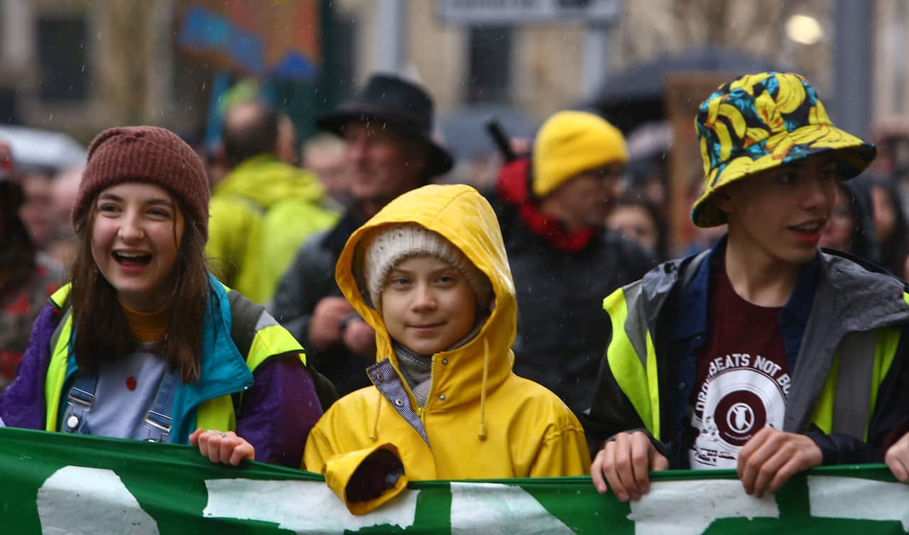 Swedish climate activist Greta Thunberg (C) takes part in a "Youth Strike 4 Climate" protest in Bristol, south west England.