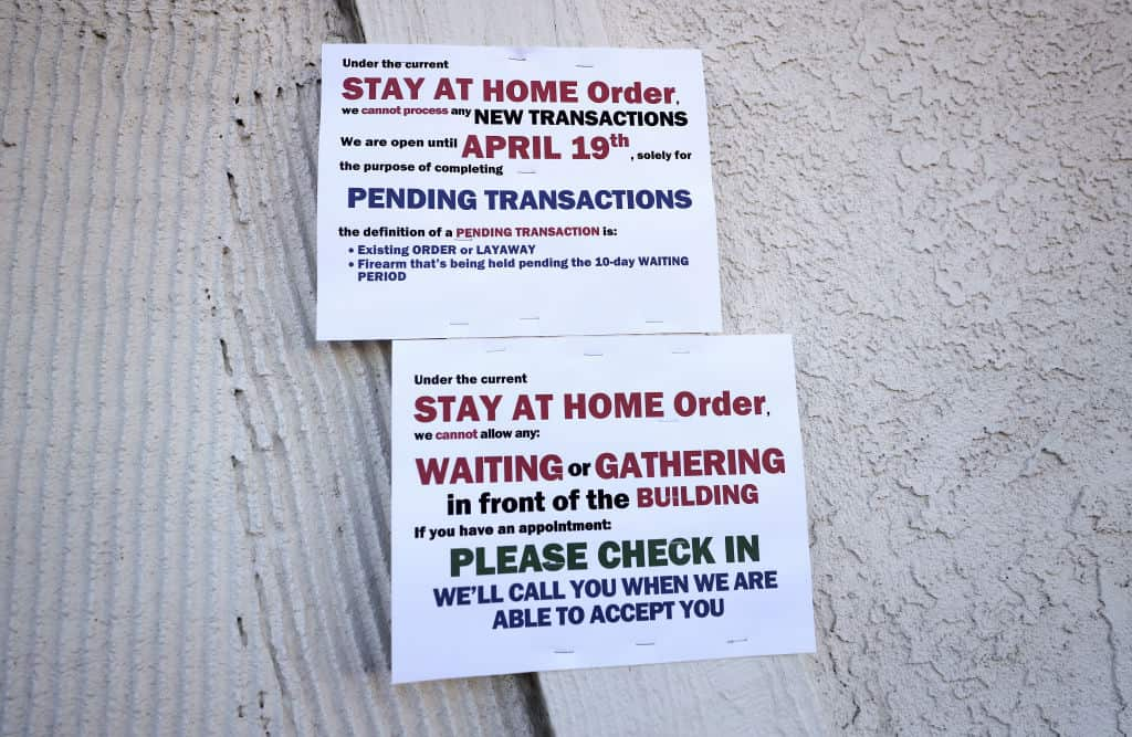 Signs are posted in front of some gun stores as the coronavirus pandemic continues