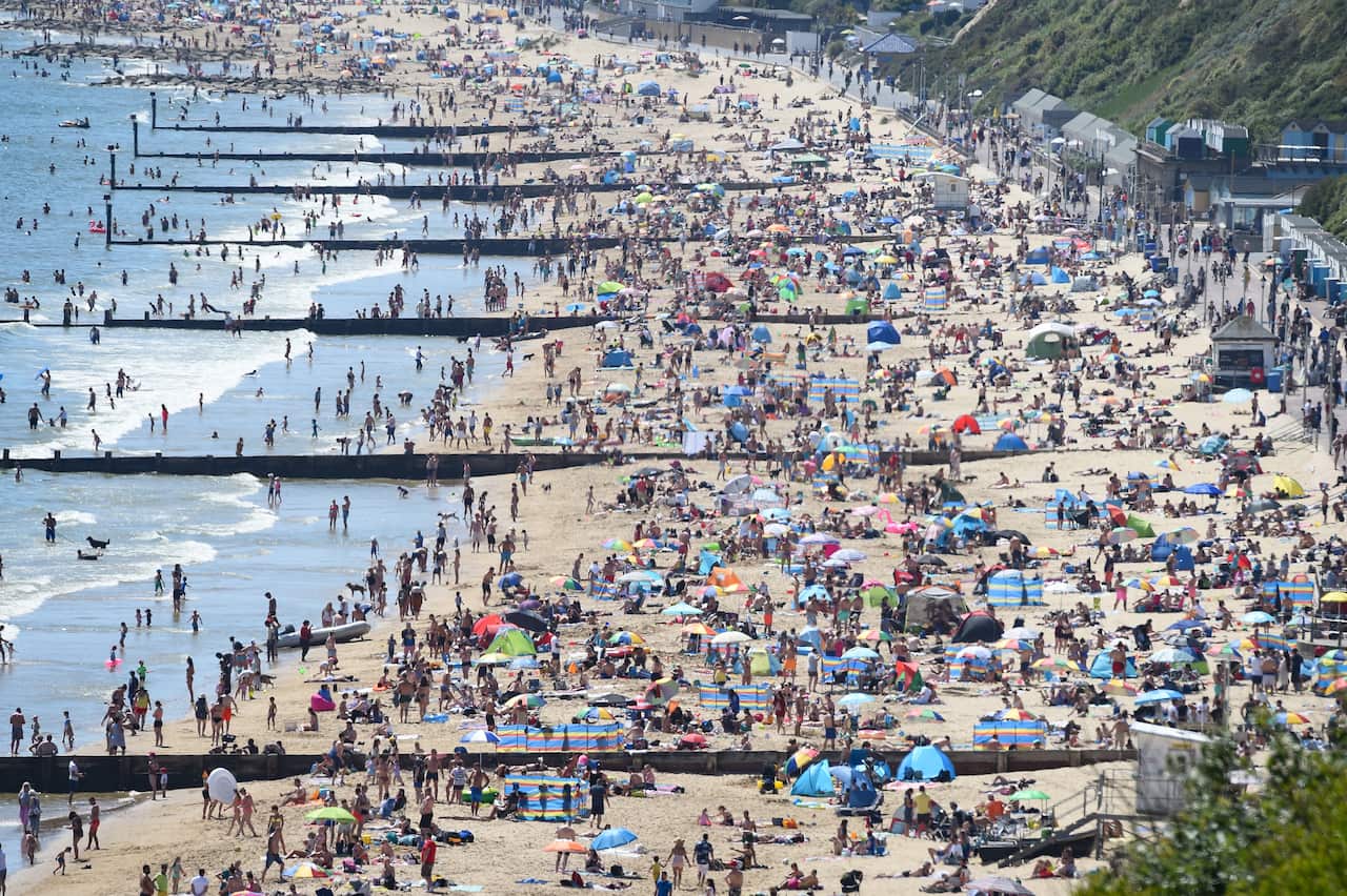 Tourists enjoy the hot weather at Bournemouth beach on May 25, 2020 in Bournemouth, United Kingdom.