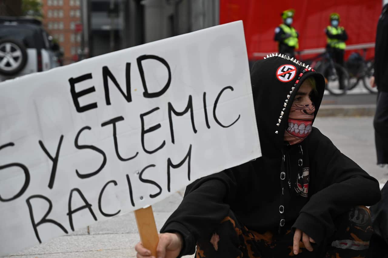 Protesters gather during a demonstration in central Montreal to demand action for the death of Joyce Echaquan on 3 October.
