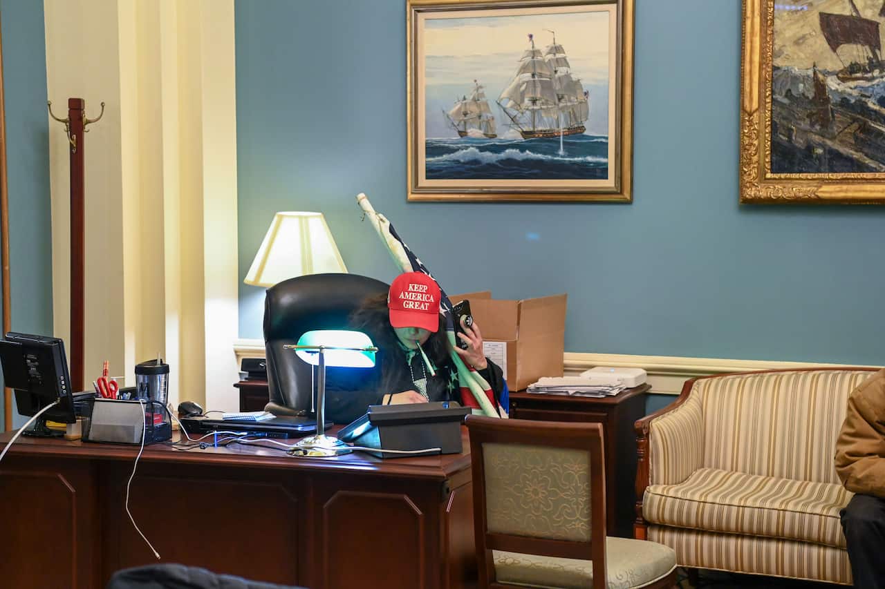 A protester inside Nancy Pelosi's office. 