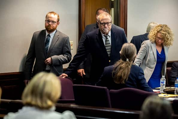 Greg McMichael, centre and son Travis McMichael, left in court in the US.