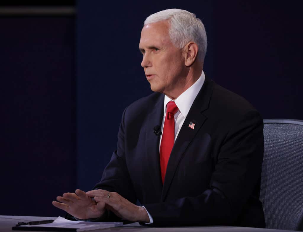 Mike Pence has accused Kamala Harris of "playing politics with people's lives".