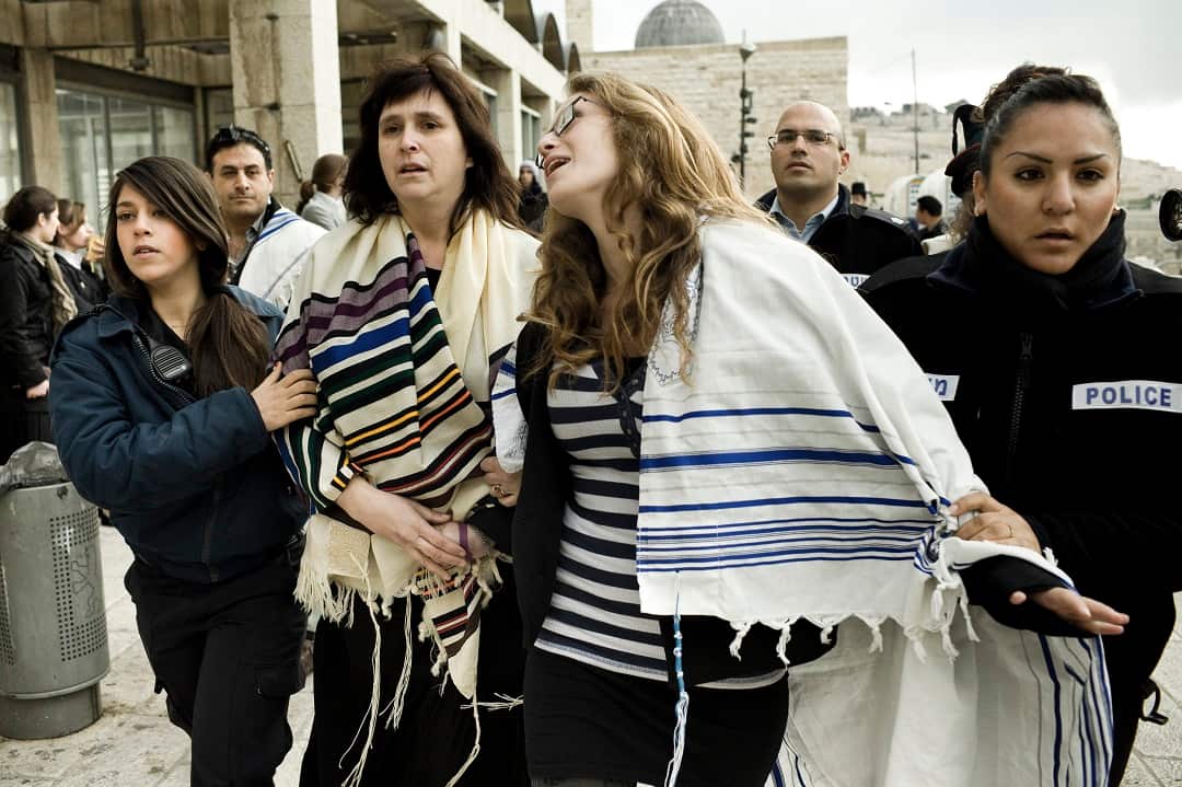 Israeli police arrest Rabbi Susan Silverman (left) at women's rights protest in 2013.