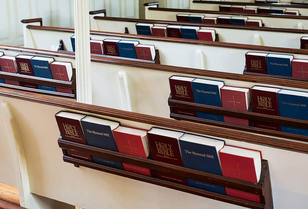 Prayer books and hymnals in church pew