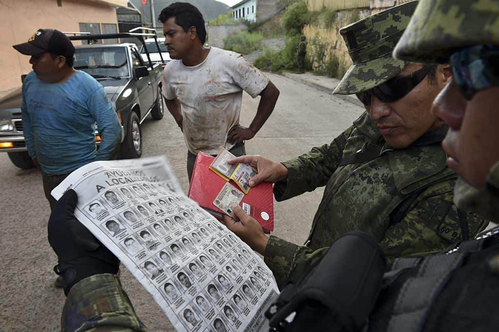 Mexican soldiers search for 40 missing students in 2014.