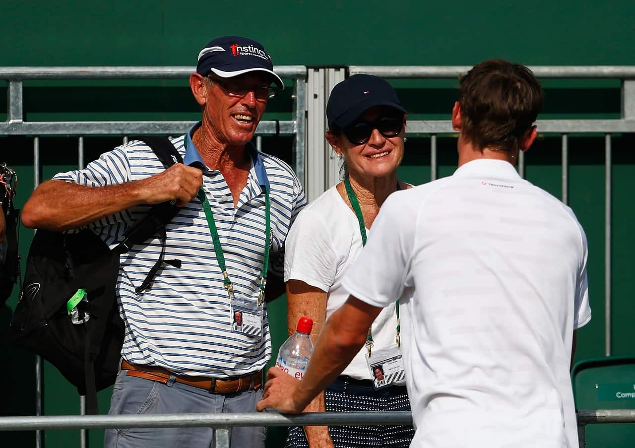 Ron Millman and Shona Millman speak to their son John Millman after a match at Wimbledon.
