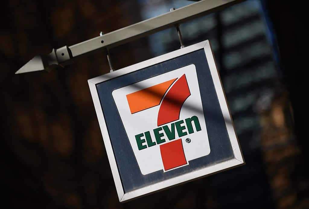 A sign hangs outside a 7-Eleven convenience store in Sydney