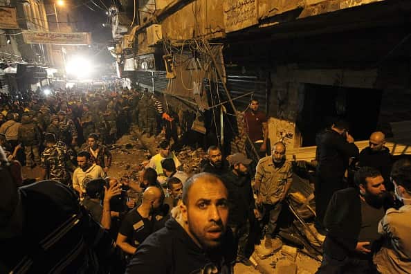 Emergency personnel gather at the site of a twin suicide bombing in Burj al-Barajneh, in the southern suburbs of the capital Beirut on November 12, 2015. (ANWAR AMRO/AFP/Getty Images)