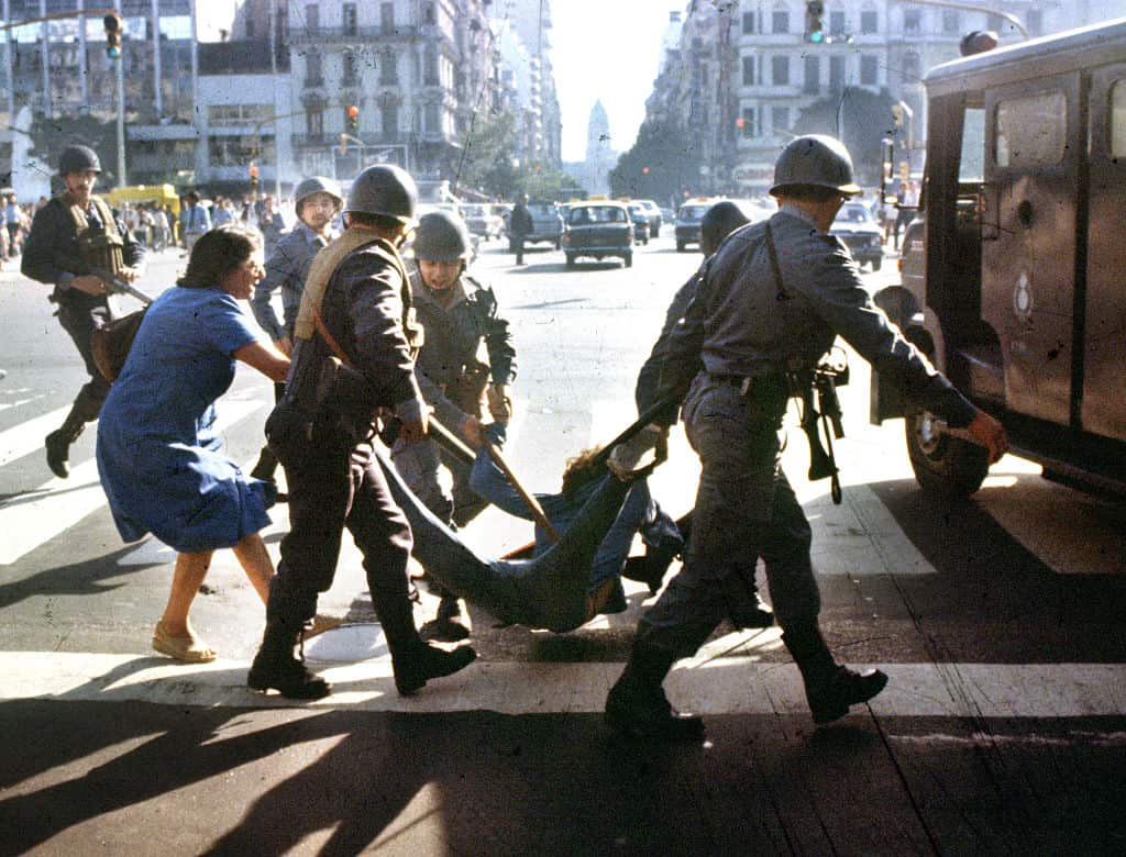 Police detain a man during Argentina's Dirty War