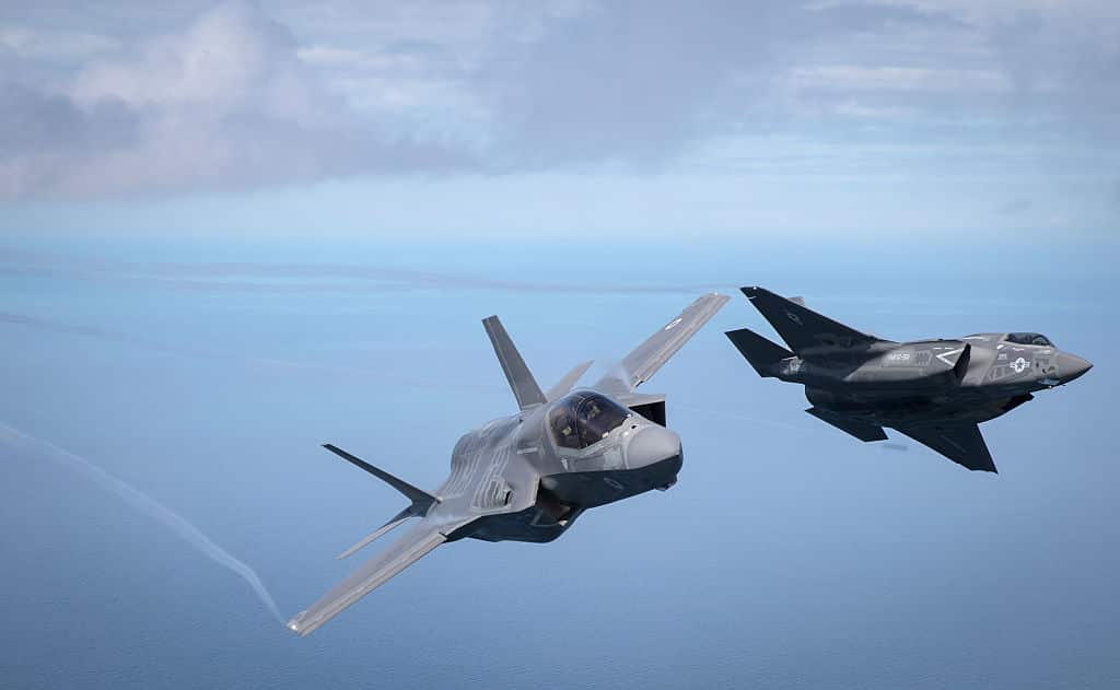 One of Britain's new supersonic 'stealth' strike fighters accompanied by a United States Marine Corps F-35B aircraft, flies over the North Sea.