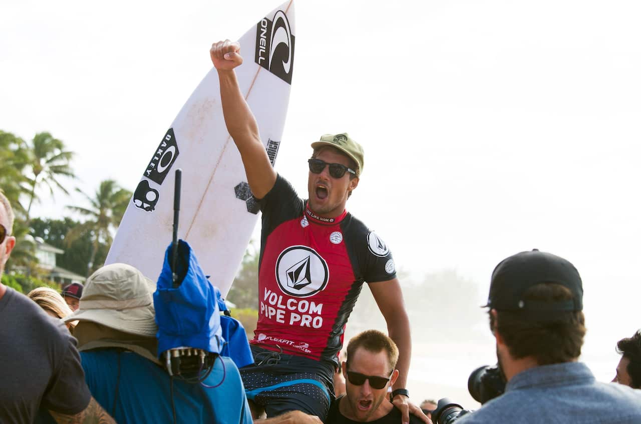 Australian surfer Soli Bailey celebrates his win of the Volcom Pipe pro in 2017, in Oahu, Hawaii.