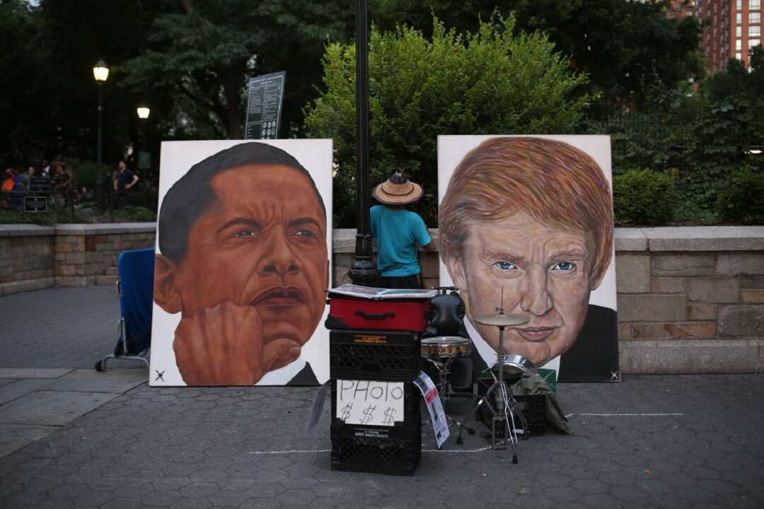 A painting of former US president Barack Obama, left, and current US president Donald Trump, right, is seen in New York City. 
