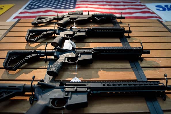 Assault rifles hang on the wall for sale at Blue Ridge Arsenal in Chantilly, Virginia, on October 6, 2017. / AFP PHOTO / JIM WATSON (Photo credit should read JIM WATSON/AFP/Getty Images)