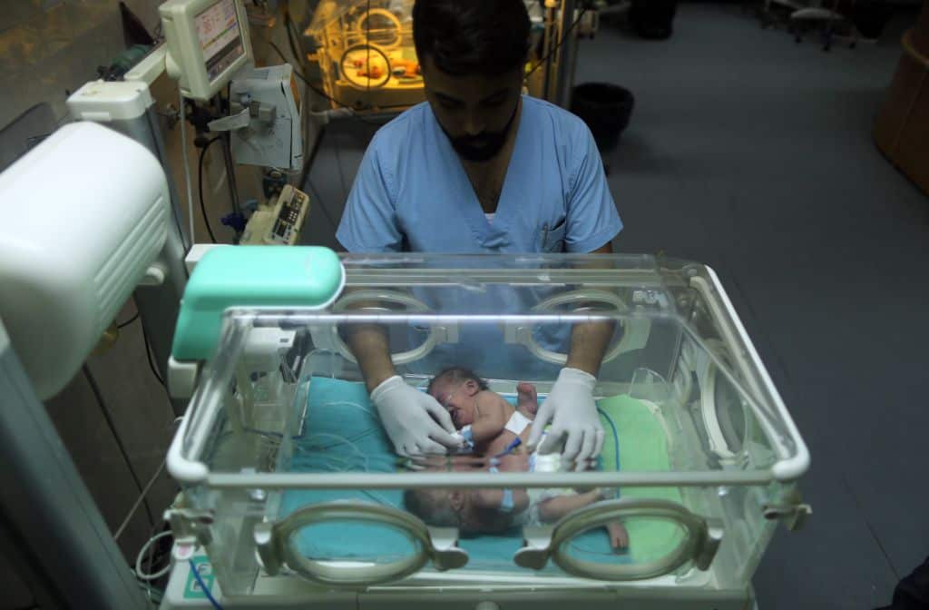 One-day-old Palestinian conjoined twins lie in an incubator at the nursery on October 22, 2017 at al-Shifa Hospital in Gaza City. / AFP PHOTO / MAHMUD HAMS (Photo credit should read MAHMUD HAMS/AFP/Getty Images)