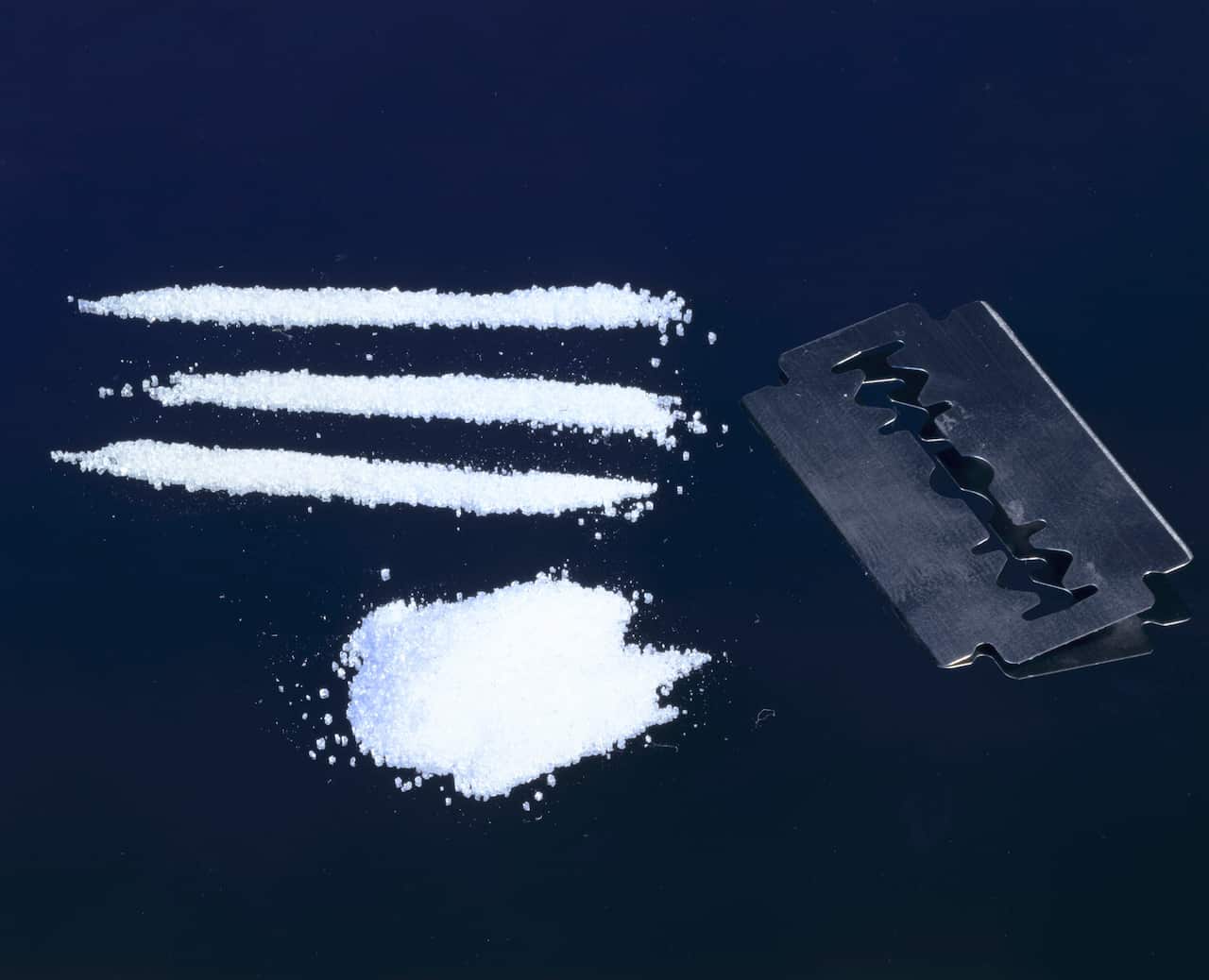 Three lines of cocaine and a razor blade, c 1990s.