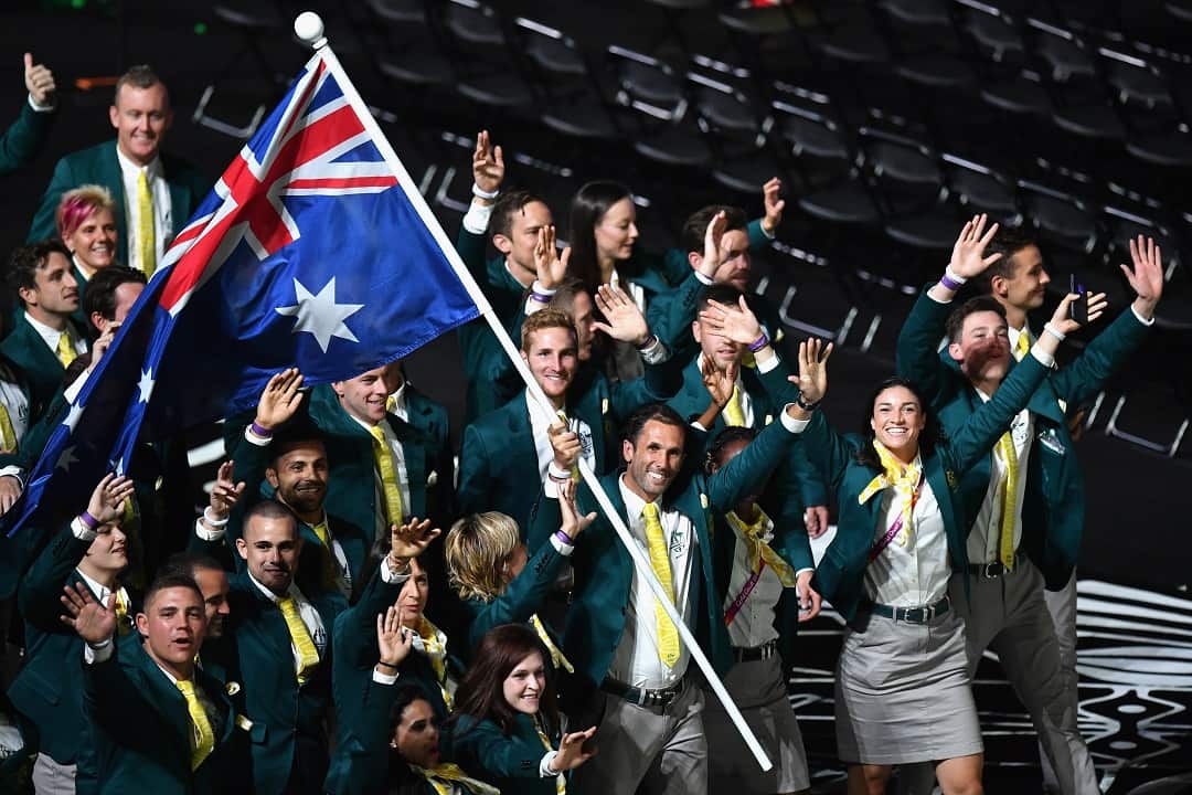 Mark Knowles, flag bearer of Australia arrives with the Australia team.