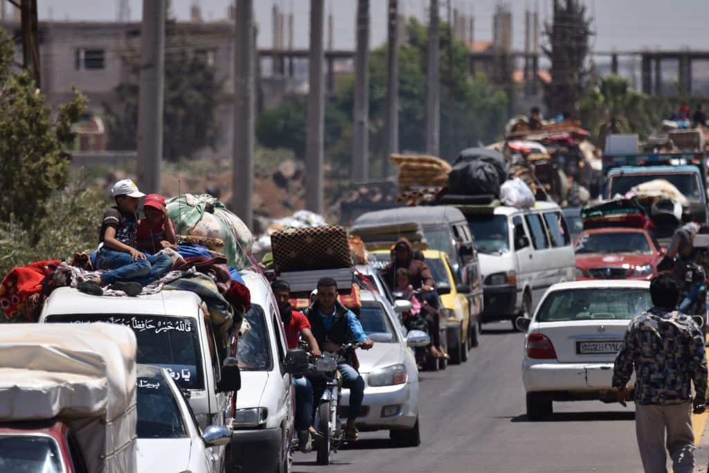 Displaced Syrians from the Daraa province come back to their hometown in Bosra, southwestern Syria, on July 11, 2018.