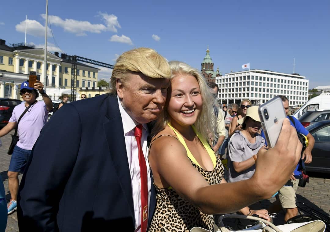 Donald Trump impersonator Dennis Alan poses for pictures in Helsinki.