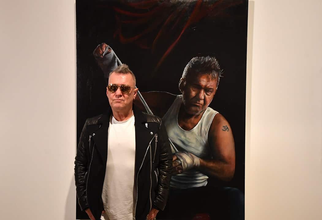 Entertainer Jimmy Barnes poses with the Packing Room Prize winning portrait by artist Jamie Preisz at the Art Gallery of New South Wales in Sydney, Thursday, May 3, 2018. (AAP Image/Mick Tsikas) NO ARCHIVING