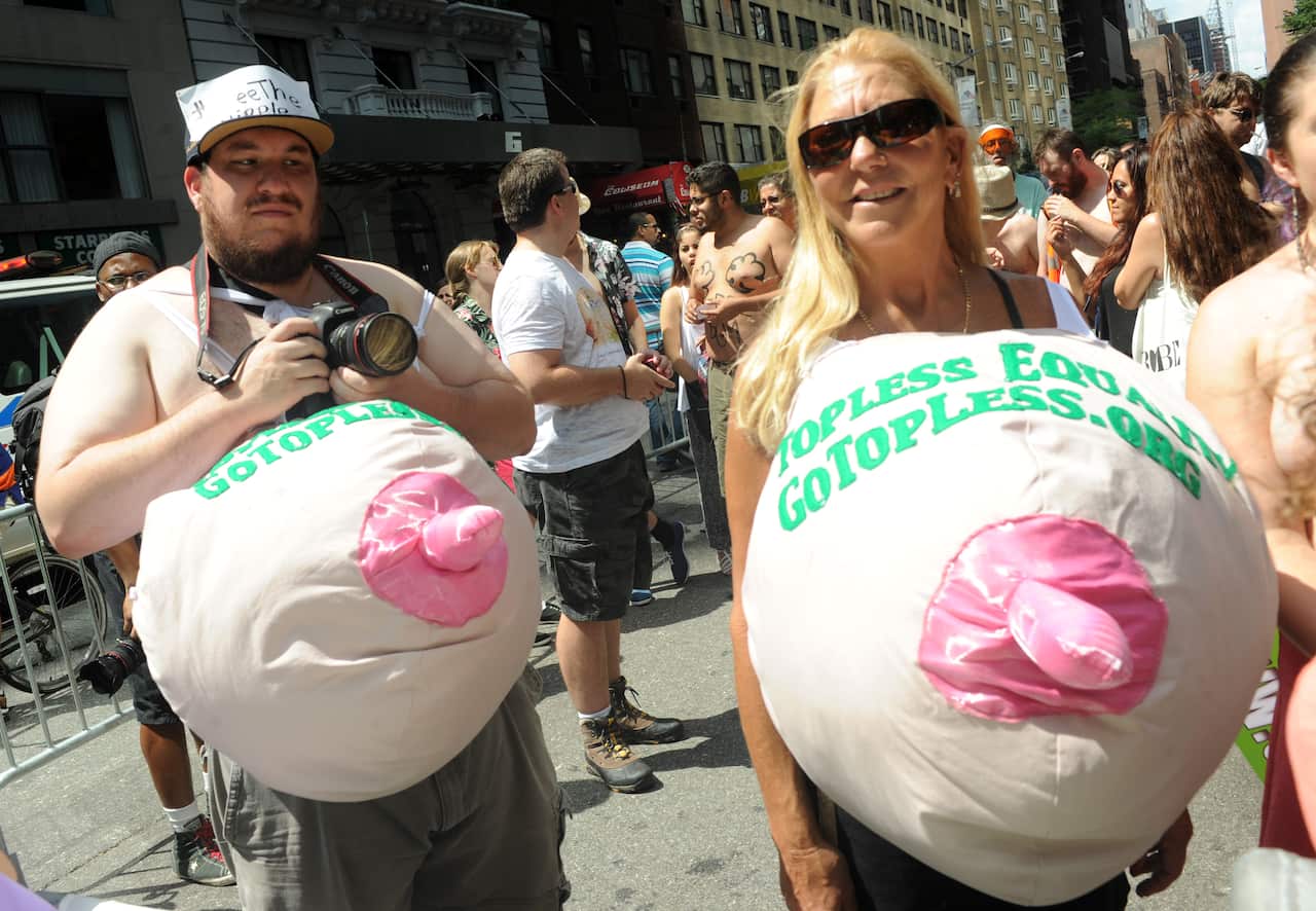 Participants move down the parade route at the GoTopless Pride Parade as part of the worldwide Go Topless Day campaign in New York City, NY, USA, on August 23, 2015. The parade heads from Columbus Circle to Bryant Park. Photo by Dennis van Tine/ABACAPRESS