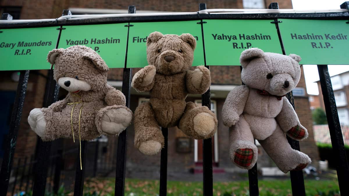 Teddy bears are placed on names of victims in tributes, close to the Grenfell Tower, London on 30 October 2019. 