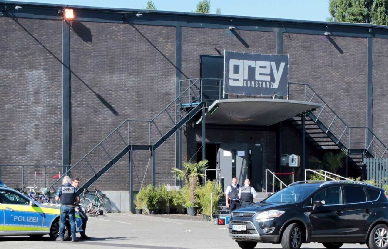  Police officers stand at the door of the night club 'Grey' in Konstanz, Germany, 30 July 2017 (AAP)