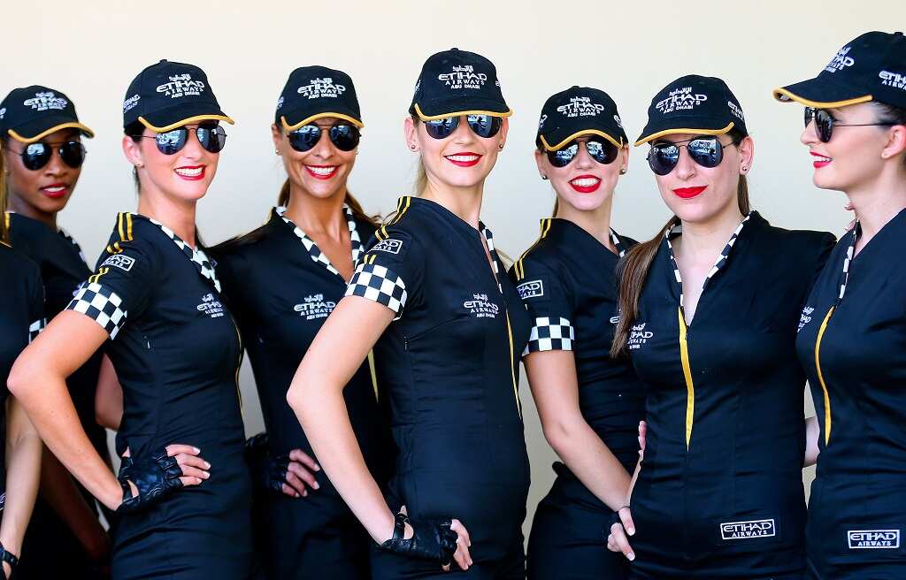 Grid Girls pose prior to the qualifying session at the Yas Marina Circuit in Abu Dhabi, United Arab Emirates, 02 November 2013.