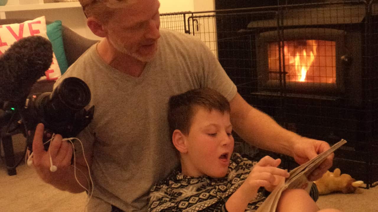 Amos reads with Caleb, but although he's physically nearly 10-years-old, he still has the mental age of a toddler.