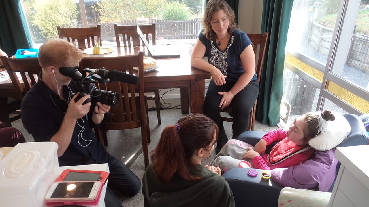 Dateline's Amos Roberts films Daryl-Ann being looked after at home in New Zealand.