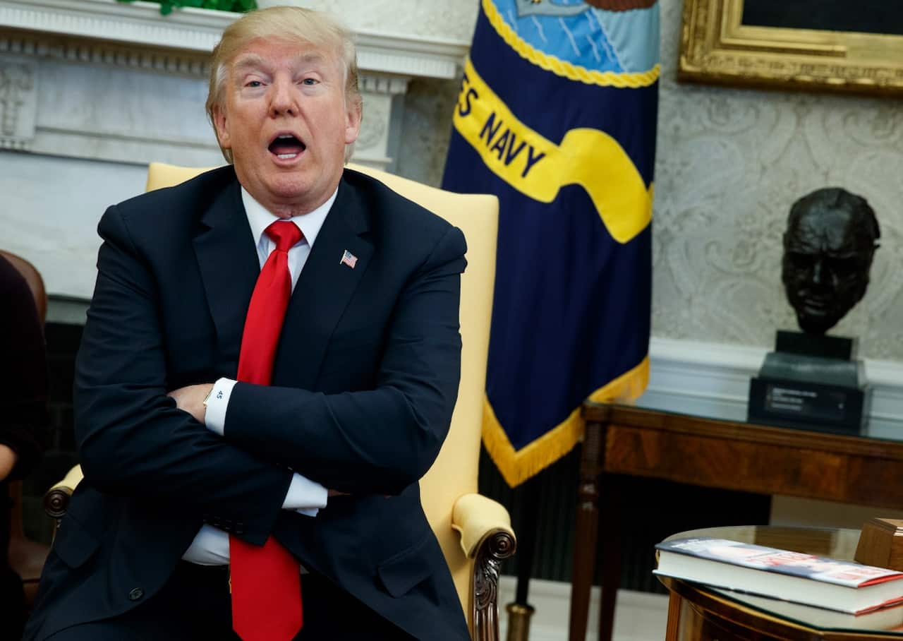 President Donald Trump speaks with reporters about allowing the release of a secret memo on the FBI.'s role in the Russia inquiry