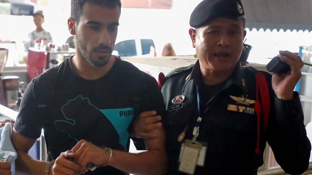 Hakeem Al-Araibi is escorted into the Criminal Court by authorities in Bangkok, Thailand, 11 December 2018.