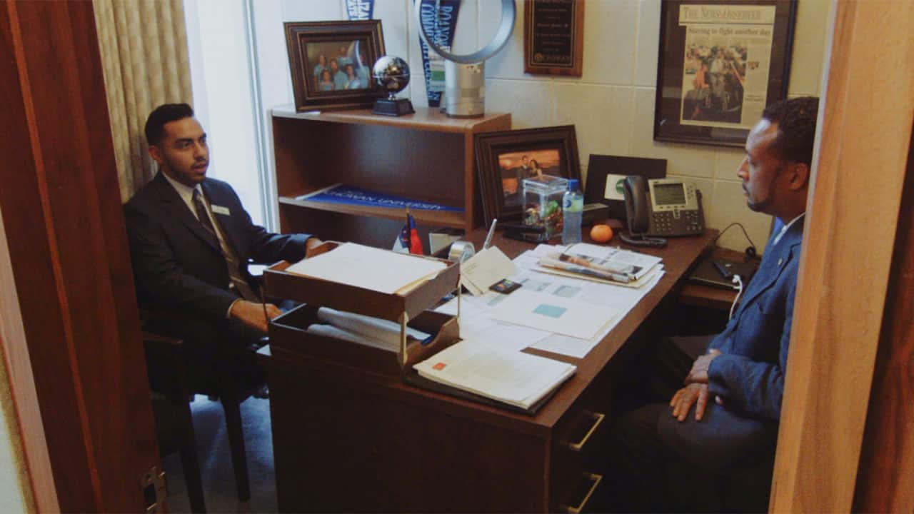 Jose Cisneros gets support for better education access from Representative Howard Hunter at the North Carolina General Assembly.